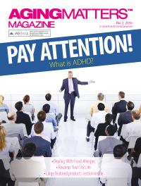Aging Matters magazine front of a man giving an educational talk