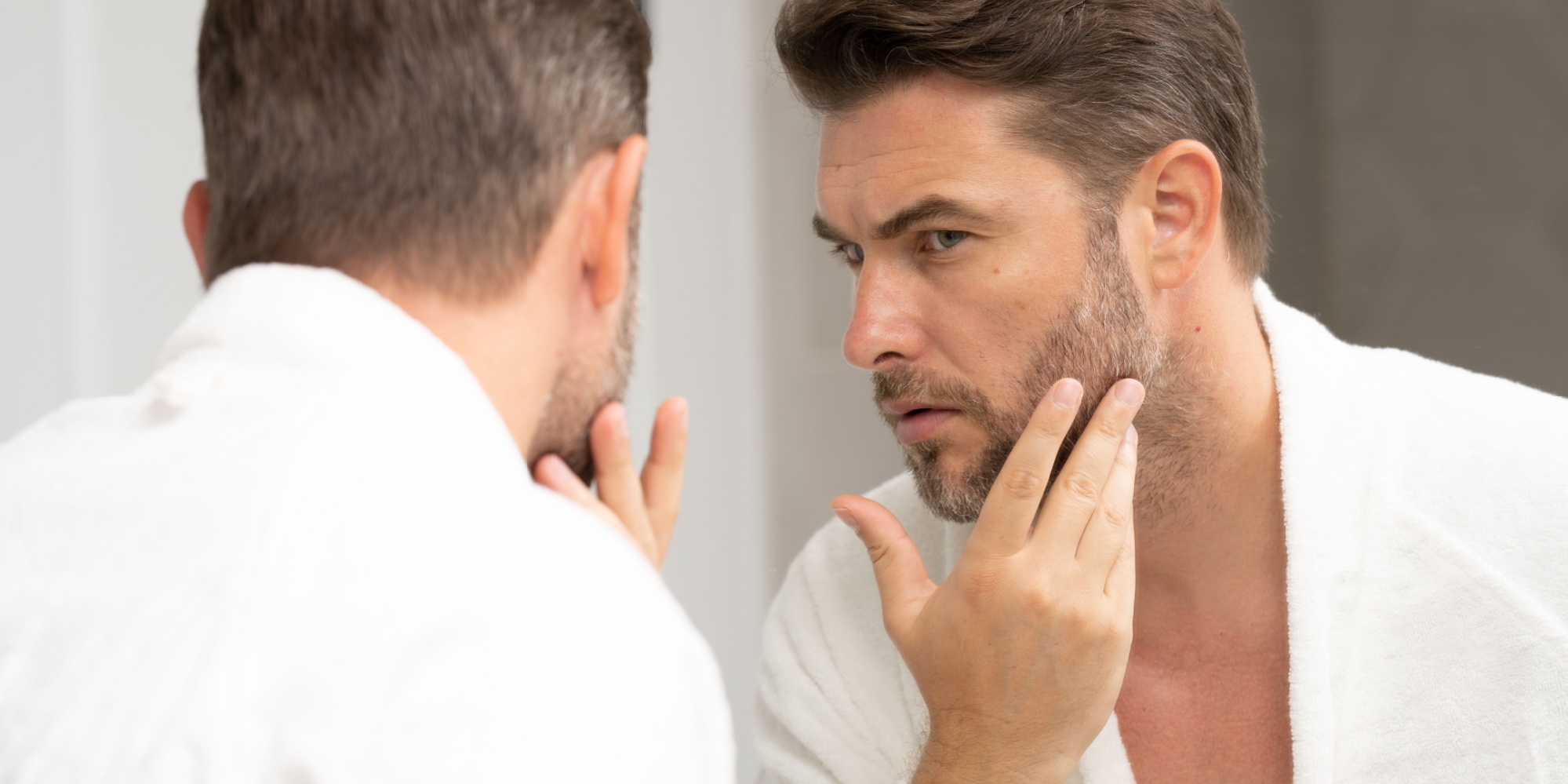 Man looking in a mirror